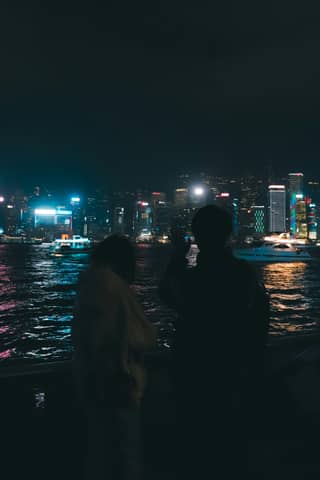 People enjoy the city lights at night.