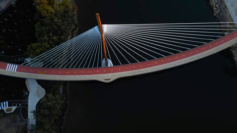 An aerial view of a bridge over a body of water