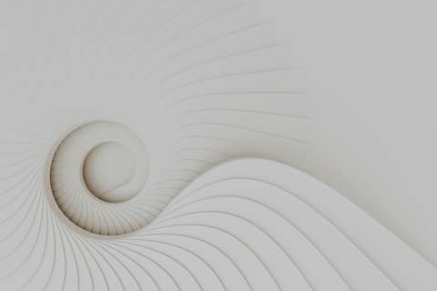 A white wall with a spiral design on it