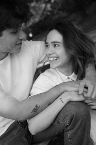 A heartfelt black and white moment between a smiling young couple in Los Angeles.