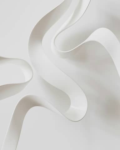 A close up of a white object on a white surface