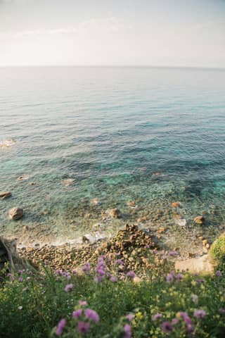 A view of a body of water from a hill