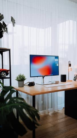 Cozy home office with modern desk setup.