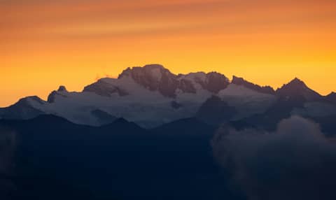 A view of a mountain range at sunset