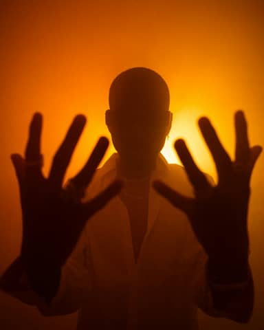 A person with their hands up in the air