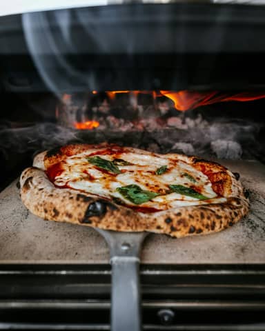 wood-fired sourdough pizza Margherita in a home wood-fired pizza oven