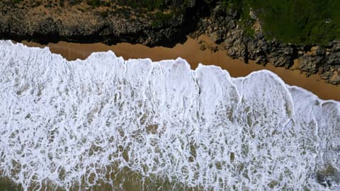 A bird's eye view of a beach and ocean