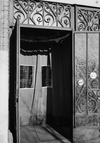 A black and white photo of an open door