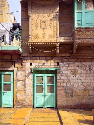 Traditional Indian architecture with ornate doors in Jodhpur, Rajasthan, India.