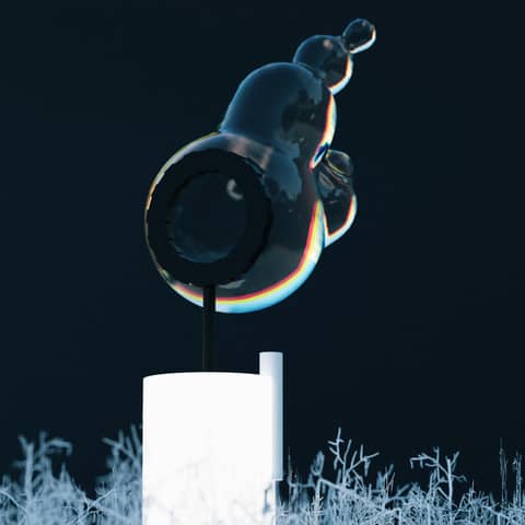 A glass sculpture stands against a dark background.