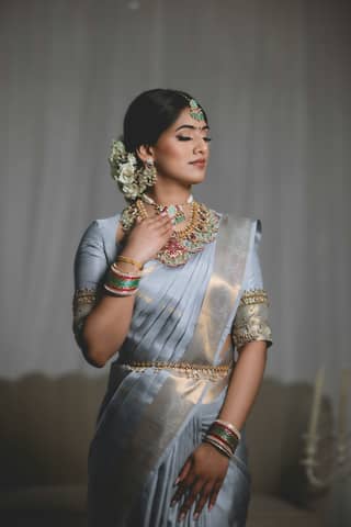 A woman wears beautiful traditional indian attire.