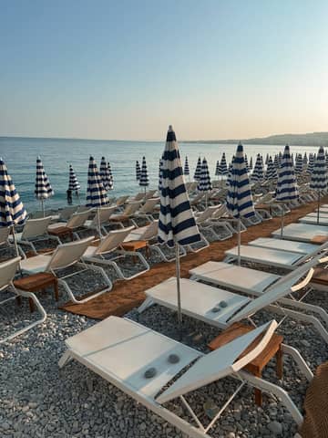 Aesthetic Beach View with Sunbeds and Umbrellas in Nice, France