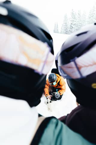 People are skiing on a snowy mountain.
