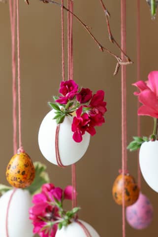 Easter eggshell planters hold vibrant flowers.