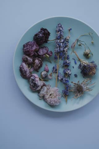 A plate with dried flowers on it